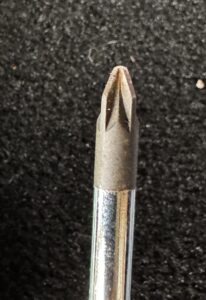The tip of a Pozi-Driv screwdriver, showing the additional points between each cross.